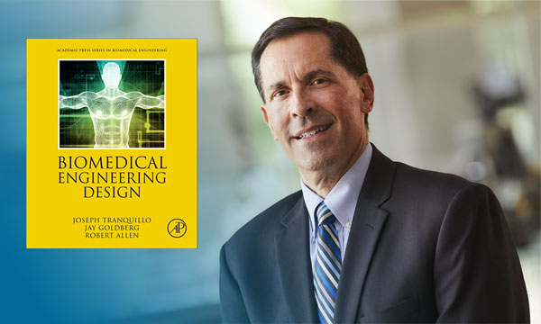 Dr. Goldberg and cover of award-winning text, Biomedical Engineering Design