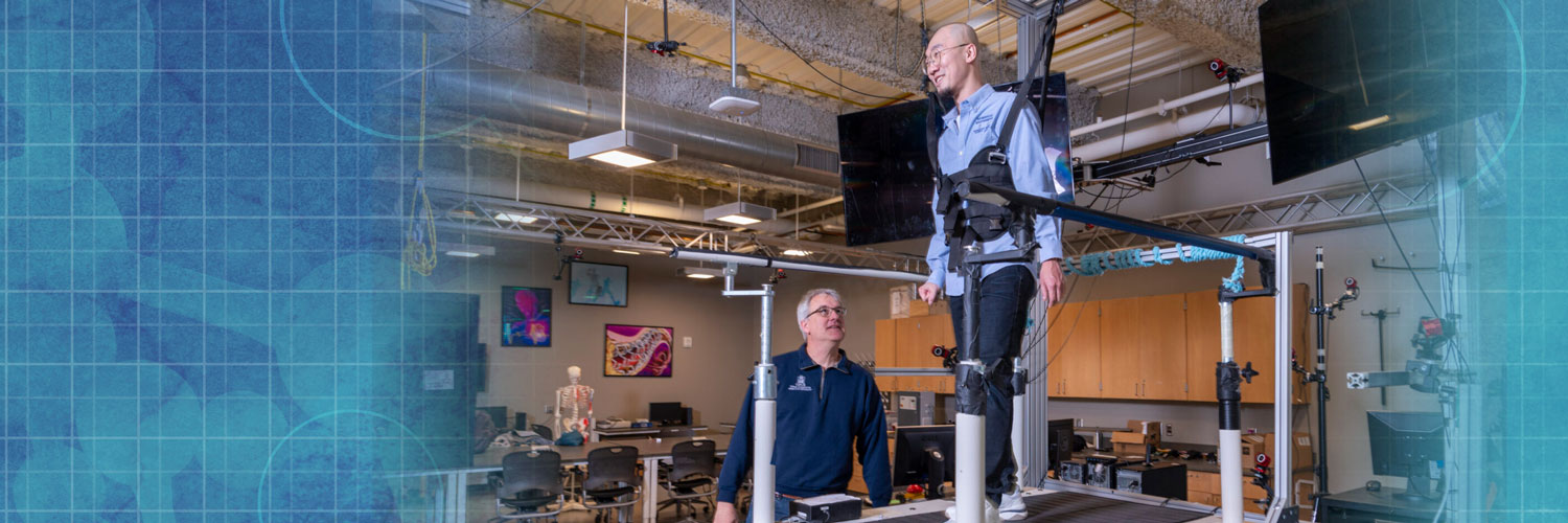 Schmit works with patient on elevated treadmill in Marquette's Human Performance Lab