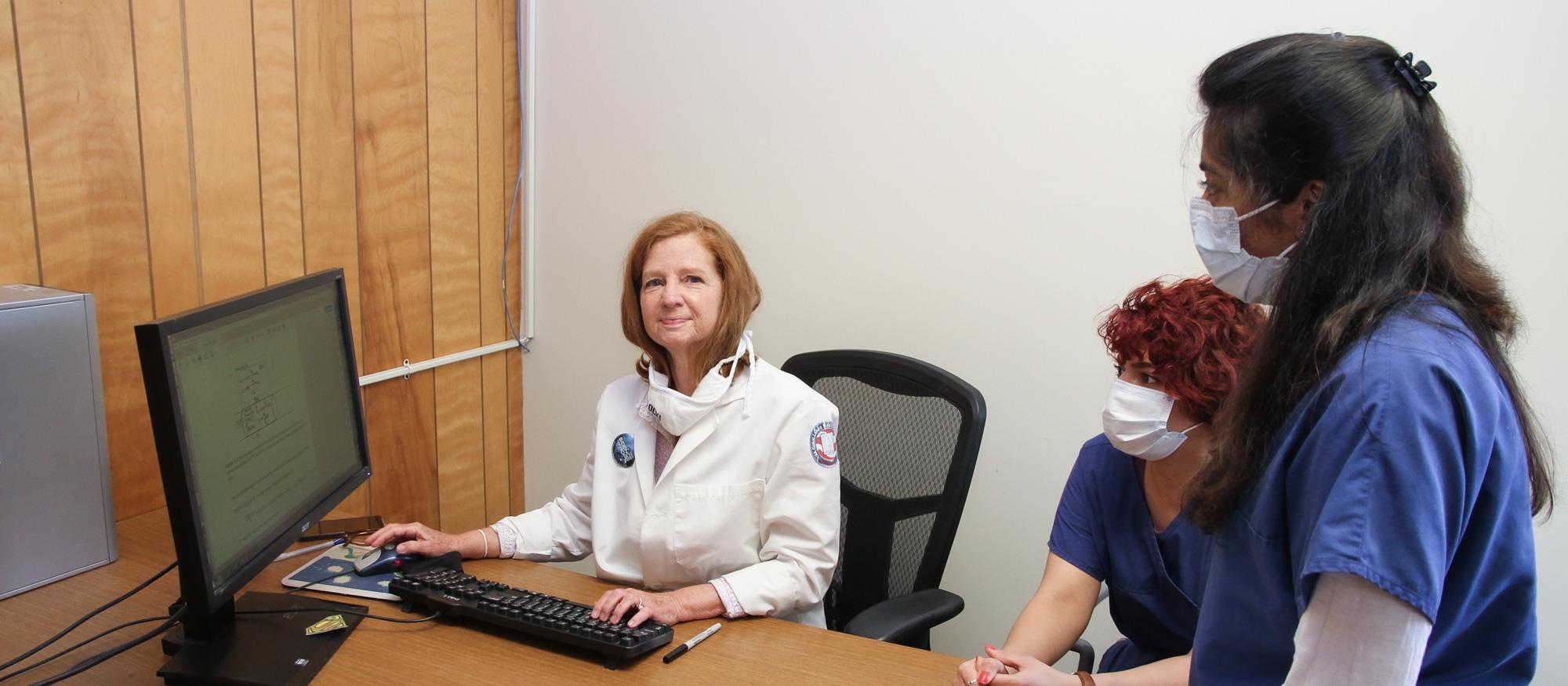 Dr. Clough works with students in CLPL office