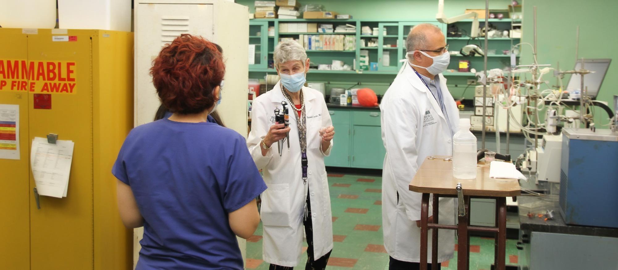 Dr. Audi and Jacobs work working with student in the CLPL