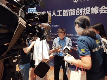Dr. Bing meets with the press after a conference in China. 