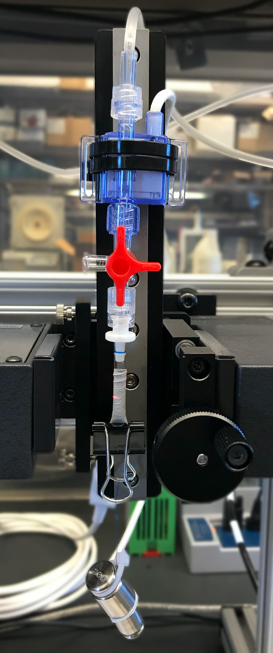 Measurement of the dynamic radial compliance of a vascular graft by applying a cyclic fluid pressure and using a laser micrometer to measure the diameter change.