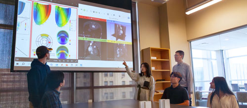 Dr. Fan discusses research with lab members of the Fan Flow Integrated Research Lab.