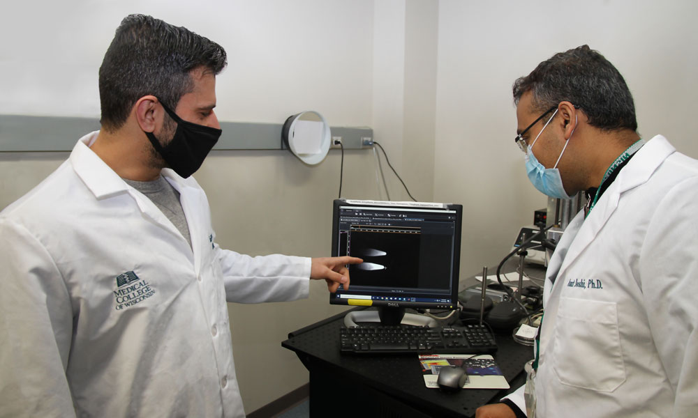 Dr. Amit Joshi working with graduate student in Nanomedicine and Image-Guided Interventions Laboratory