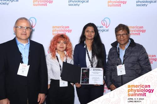 BME poses with award at APS, 2023
