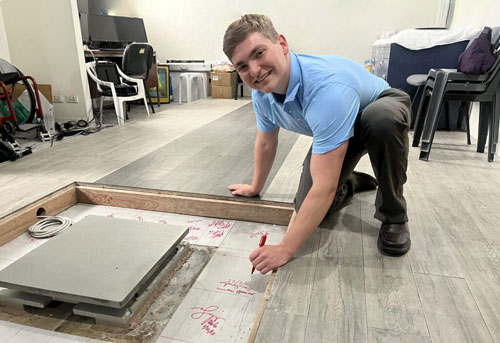 BME student signs forceplate during international engineering experience
