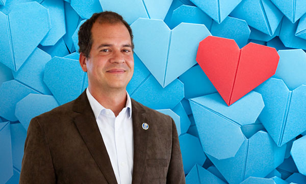 Dr. Brandon Tefft, background of folded blue paper hearts