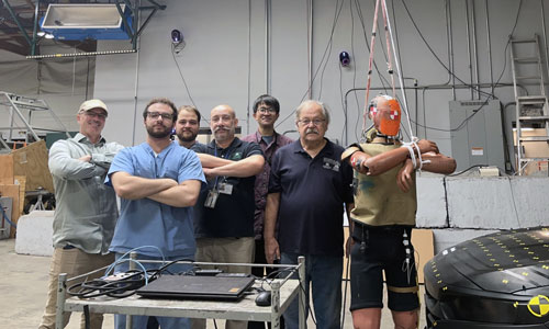 Ralph Audi and ZVAMC Research Team pose for photo with Honda Crash Test Dummy and Collaborator